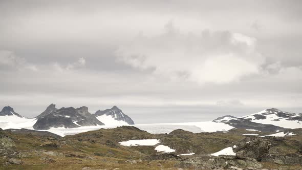 Clouds over Snowy Mountains, Norway. Timelapse alt