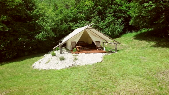 Tracking shot of a glamping tent in an eco camping in Slovenia. alt