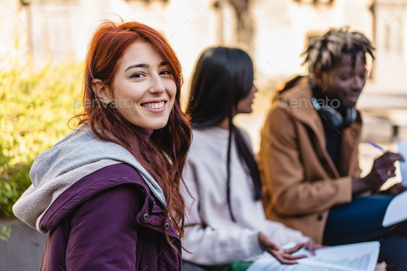 Cheerful Student Enjoying Campus Life Outdoors Stock Photo by baffos