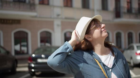 Portrait of Pretty Traveler Woman in Hat Looking Around Have Fun