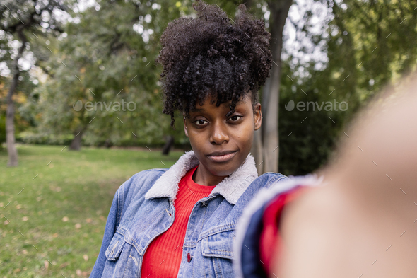 Single middle aged african american woman looking at camera Stock