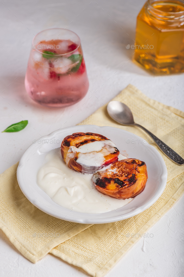 Served Grilled Peaches with Honey and Whipped Cream