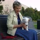Woman Sitting in Park with Pregnant Dog - VideoHive Item for Sale
