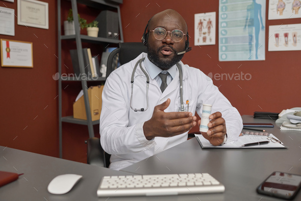 Doctor Prescribing Medicine to His Patient During Video Call