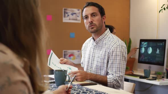 Millennial creative professionals working in a creative office alt