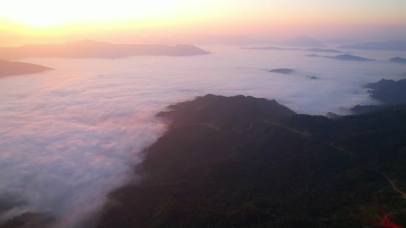 Flying over the clouds during morning sunrise.  wonderful morning sunrise natural Landscape. alt