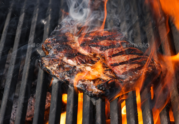 Searing and smoking ribeye steaks on grill