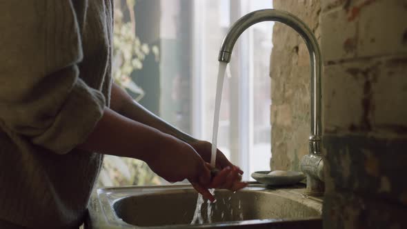 Artist Is Cleaning Painting Brushes alt