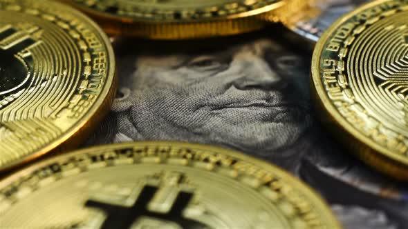 Golden Bitcoin Coins On US Dollars