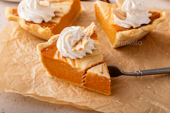 Pumpkin cheesecake swirl pie topped with whipped cream