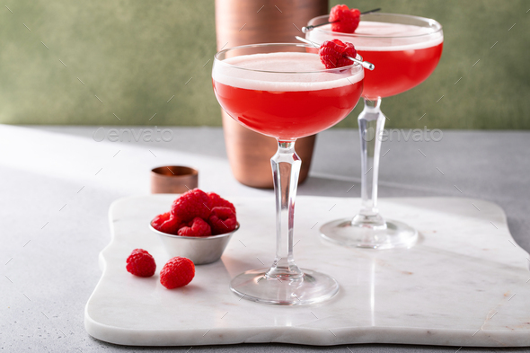 Raspberry martini cocktail with vodka, juice and raspberry liqueur