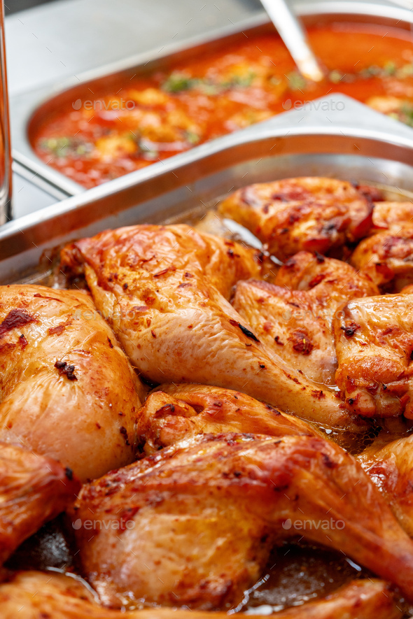 Metal tray with fresh baked chicken in a canteen Stock Photo by ...