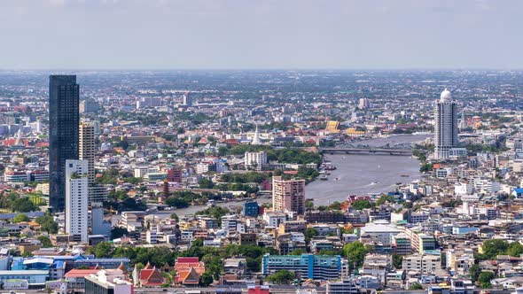 Bangkok city above old town area and Chao Phraya River, with water traffic – Time Lapse