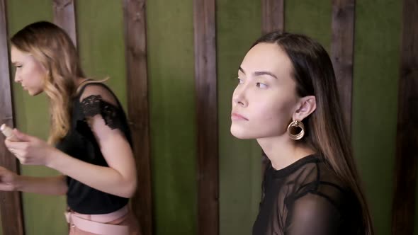 Makeup Artist Applies Base Tone Cream on Asian Girl's Face at Beauty Salon