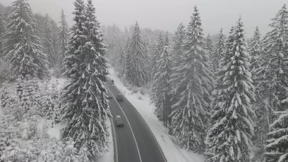 4k Aerial Shot In The Forest Over The Road Winter With Parking Spot