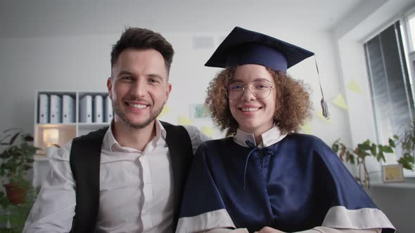 Online Graduation Happy Female University Graduate Student with Her Husband at Ceremony to Receive