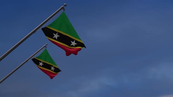 Saint Kitts And Nevis Flags In The Blue Sky - 4K