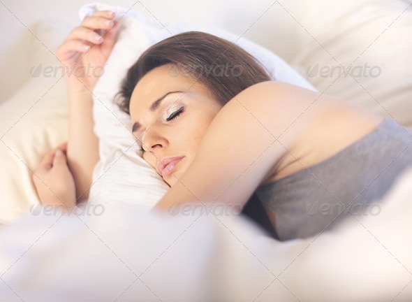Asleep Woman Lying on Bed - Stock Photo - Images