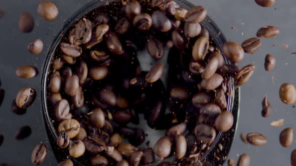 Roasted Coffee Beans Spin in Grinder Top View Closeup alt