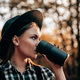 Hipster woman drinking hot coffee or tea, thermos, golden park, forest in autumn - PhotoDune Item for Sale
