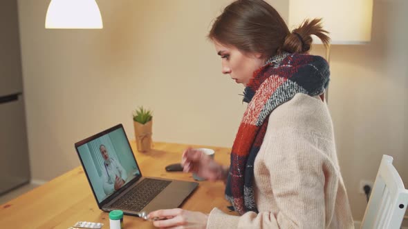 Woman in Selfisolation Communicates with a Doctor By Video Call Using a Laptop a Patient Consults a alt