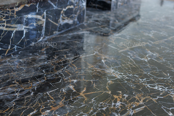 Black Marble with white and gold veins. Decorative tiles for finishing fireplace an old house