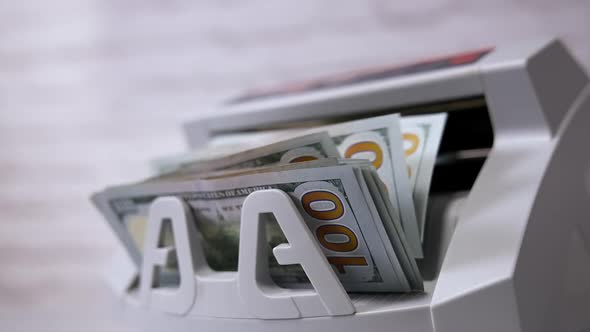 Money counting equipment for paper money calculation. US national paper currency. alt