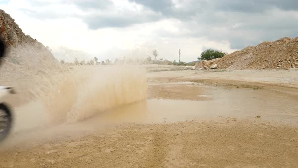 Slow motion view of a motorcycle ride in a quarry in Slovakia alt