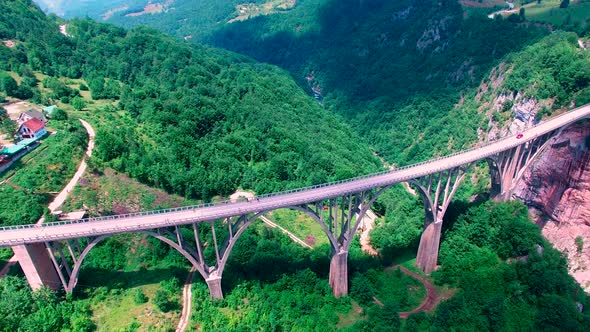 Drone Flight Above an Old Mountain Bridge Across The Canyon alt