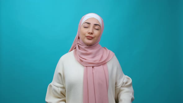 Exhausted Young Muslim Woman in Hijab Yawning Widely Looking Sleepy and Drowsy
