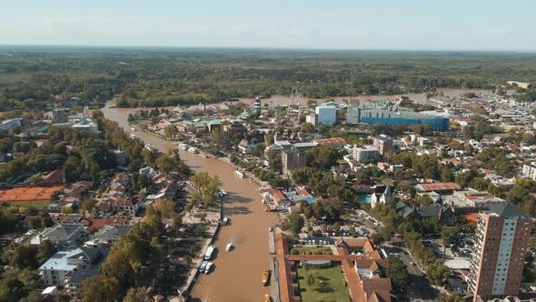 Aerial panoramic view of Tigre city and river with Paraná delta and blue sky as background alt