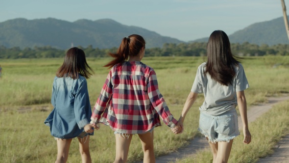 Group of young Asian women running having fun together a summer traveling.