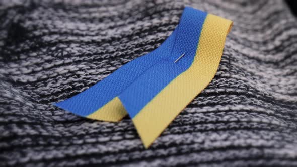 Closeup Shot of a Ukrainian Symbol Attached to a Cloth