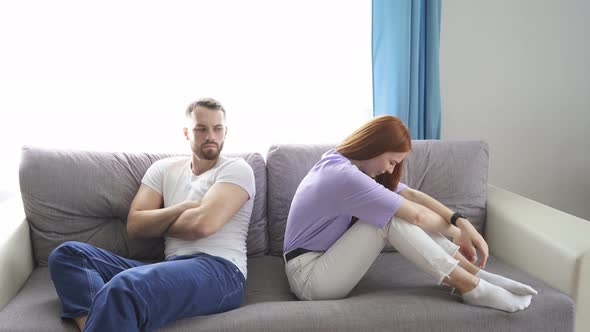 Depressed Wife Feeling Upset After Fight with Husband, Sit Back To Back. alt
