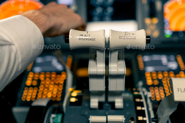 thrust lever in the cockpit of an airplane a close-up view of flight on ...