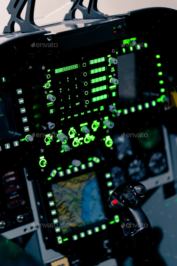 closeup of the cockpit of plane with many buttons on the control panel