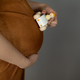 Pregnant woman drives a wooden car on baby belly - PhotoDune Item for Sale