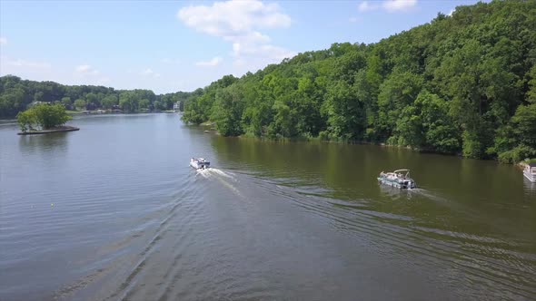 Drone Shot of two Pontoon Boats on Lake Shannon, Michigan, Stock Footage