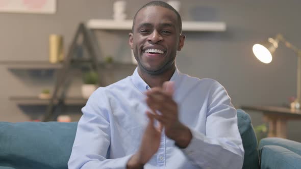 Portrait Shot of Happy African Man Clapping Applauding alt