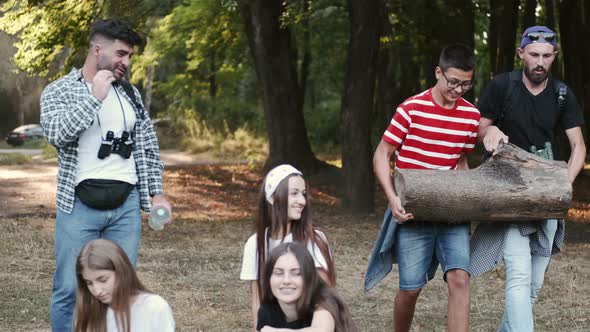 Group of Friends Camping in a Forest alt