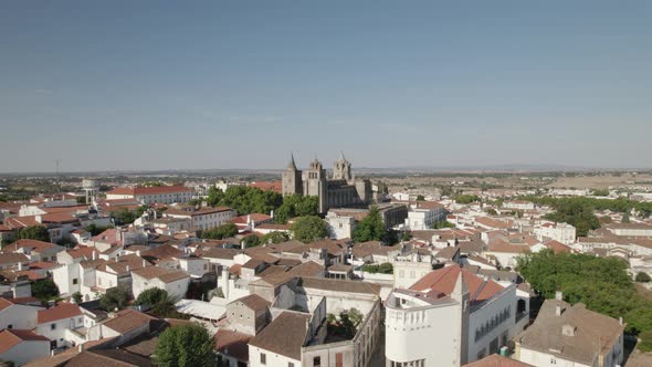 Evora cathedral monastery in Portugal, aerial view, wide orbital shot cityscape in Europe