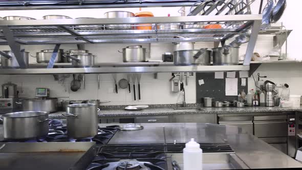 Dolly Shot Team of Chefs Cooking on Pan at Commercial Kitchen alt