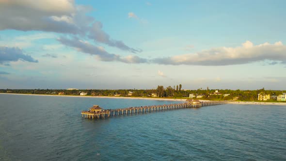 Naples Beach and Fishing Pier at Sunset, Florida. alt