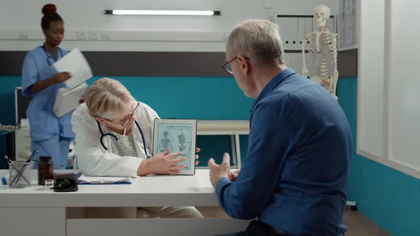 Doctor Osteopath Explaining Human Skeleton Illustration alt