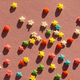 festive pink background with scattered small multicolored stars. confectionery sprinkles - PhotoDune Item for Sale