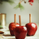 Red apples with cinnamon sticks on kitchen table with sugar at wall background - PhotoDune Item for Sale