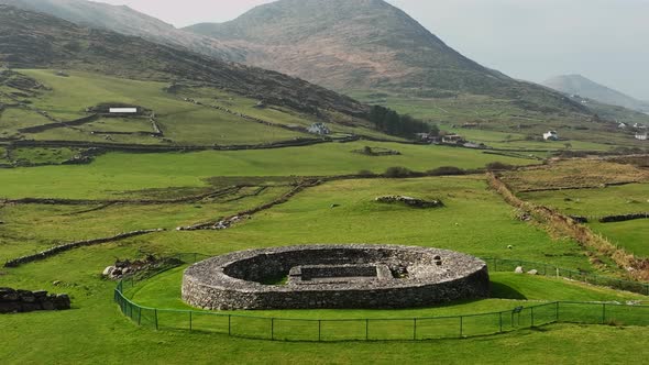 Loher Ringfort, Kerry, Ireland, March 2022. Drone pushes towards the ancient monument from the east alt