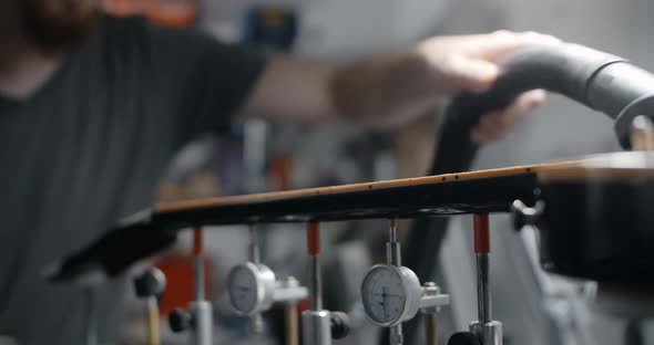 Guitar Tech Uses Vacuum Cleaner the to Remove the Wood Dust From Guitar Neck After Sanding Musical alt