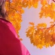 Portrait of Woman with Autumn Leafs Enjoying Autumn Time - VideoHive Item for Sale