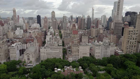 Aerial view of high-rise in Lenox Hill and the Central park in cloudy Manhattan, NYC, USA - reverse, alt